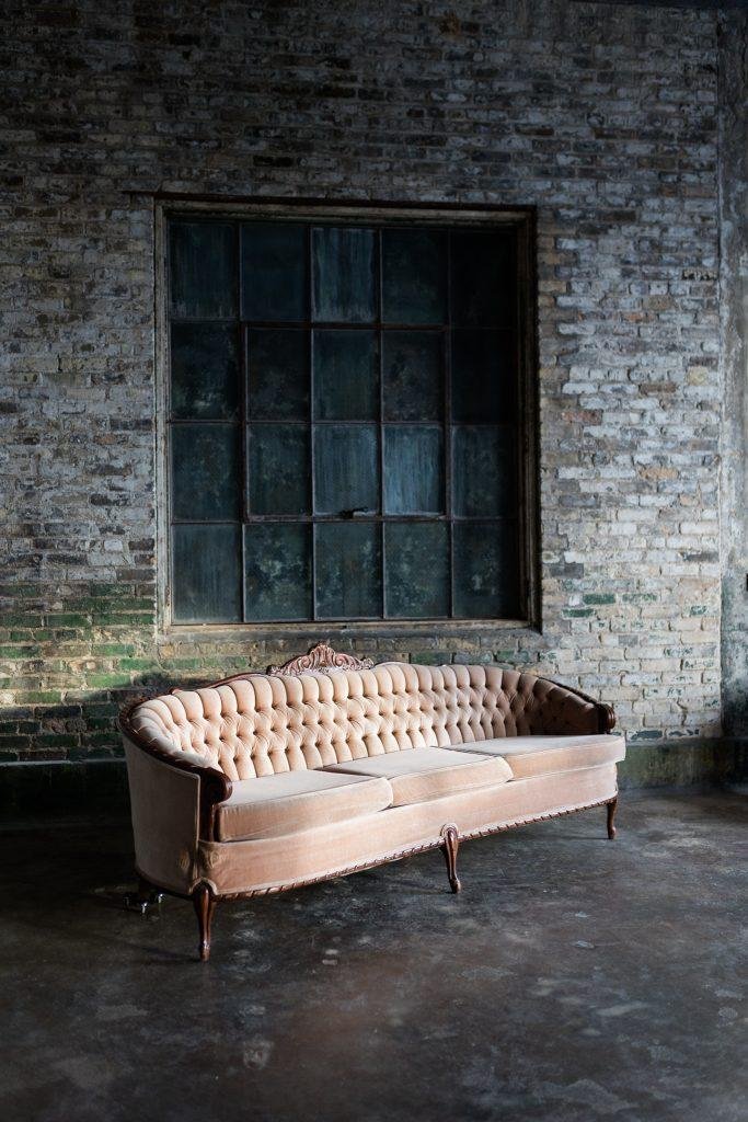 pink couch infant of rustic window- the urban studio