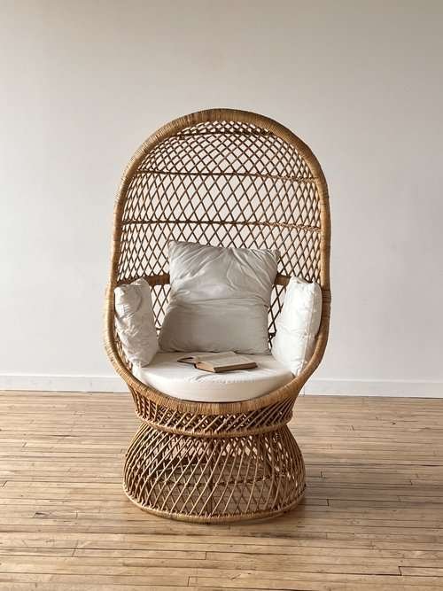 egg chair with white cushions