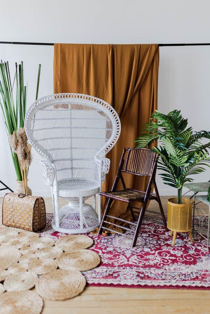 white wicker chair and other various photography props