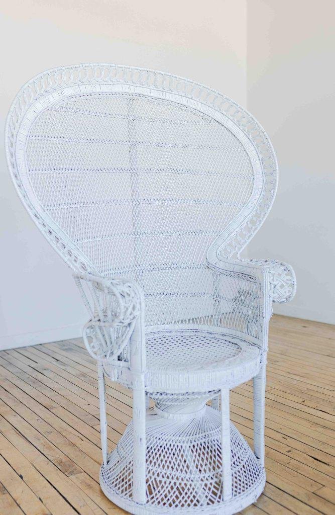 white wicker photography prop chair
